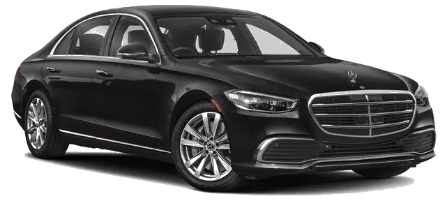 Black Mercedes S-Class sedan on city street